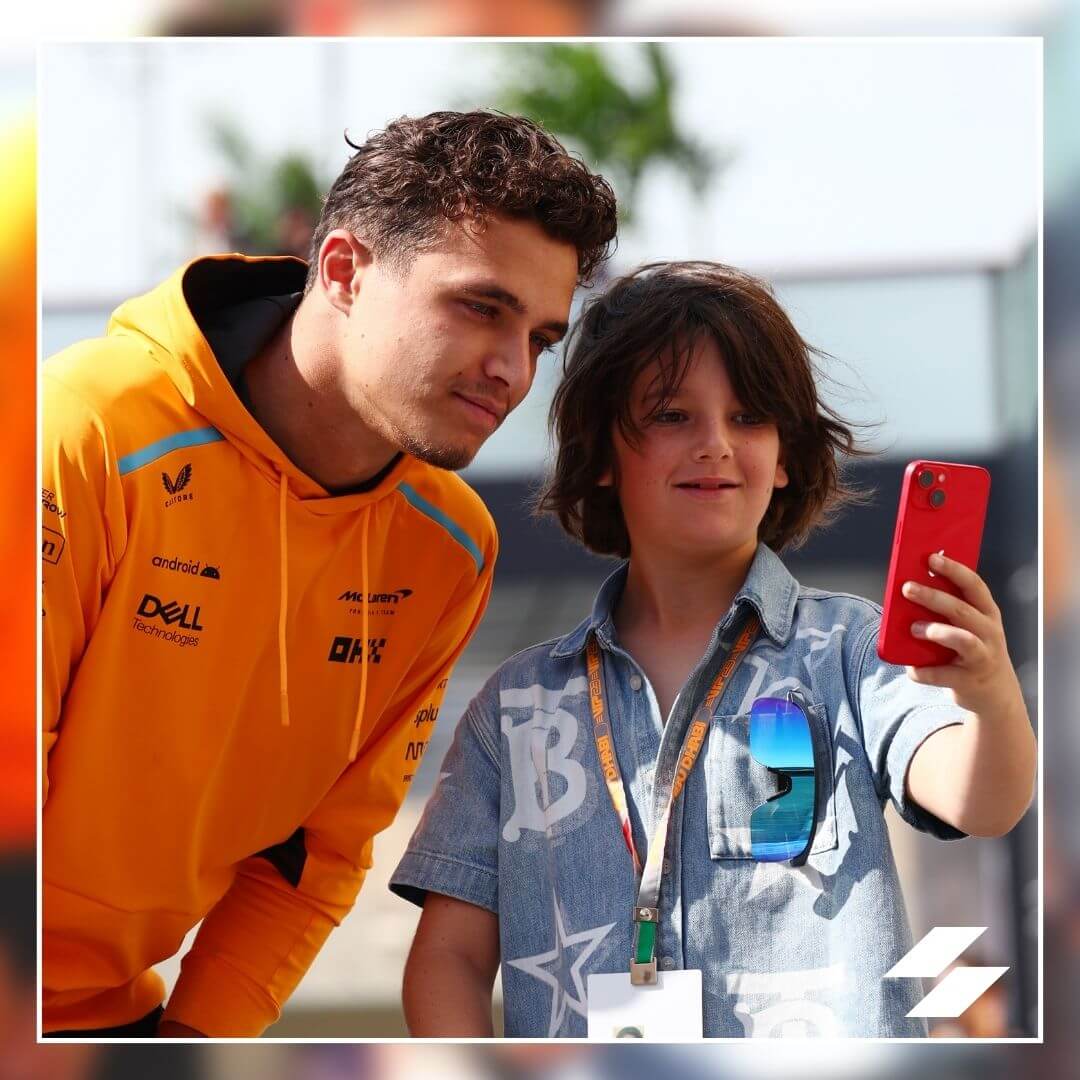 Abu Dhabi Grand Prix Lando Norris stops for a selfie with a Formula One fan at the Yas Marina Circuit