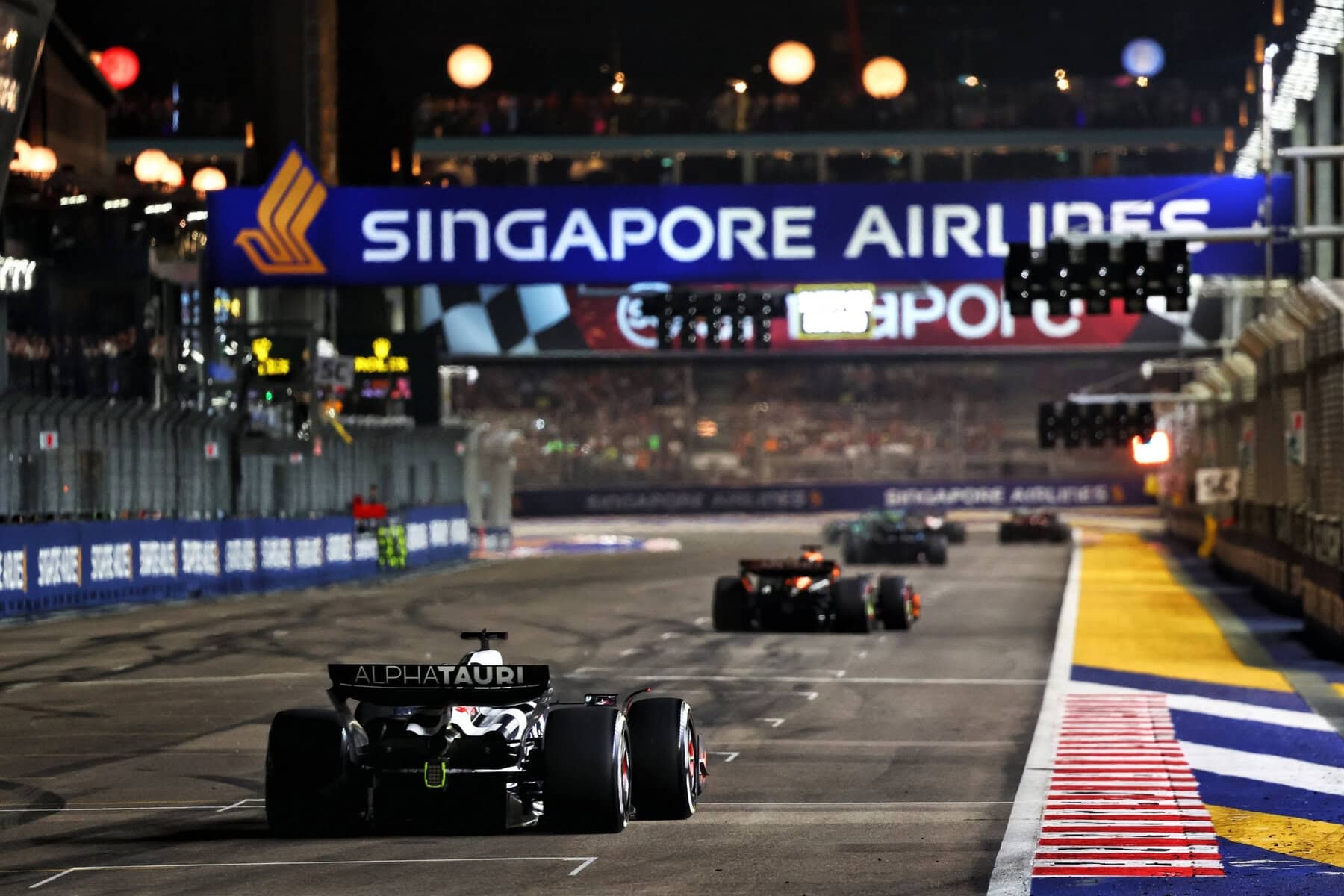 Cars crossed the finish line at the Singapore Grand Prix.