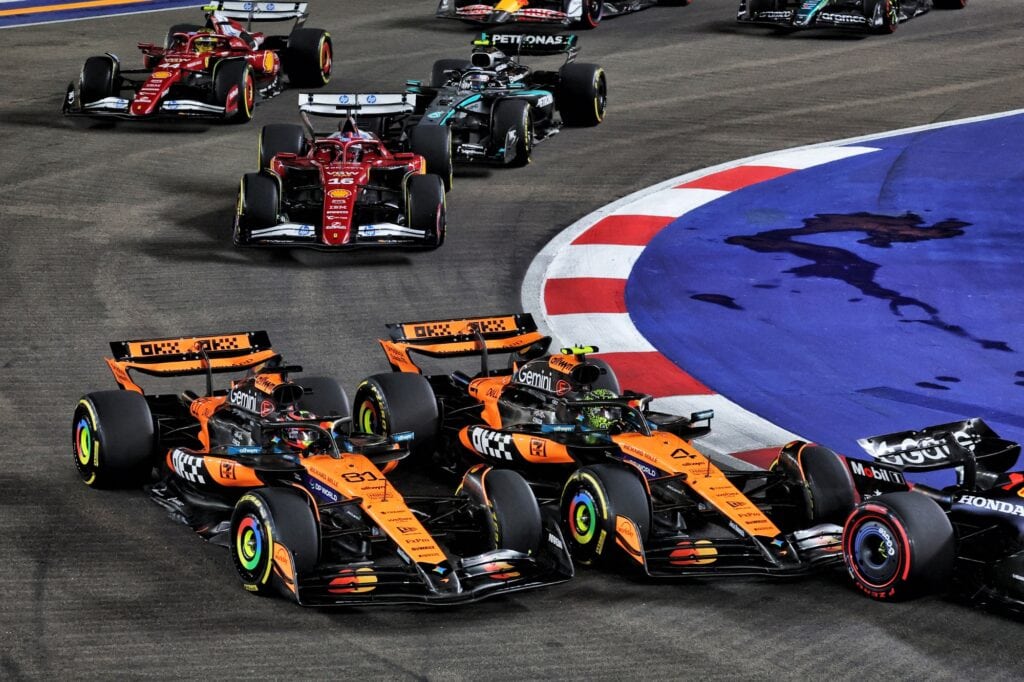 Norris makes contact with Piastri at Turn 1 during the 2025 Singapore Grand Prix